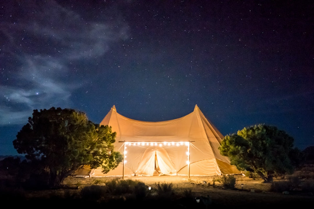 Sleeping bag inside a cosy tent under the stars — down vs synthetic sleeping bag NZ