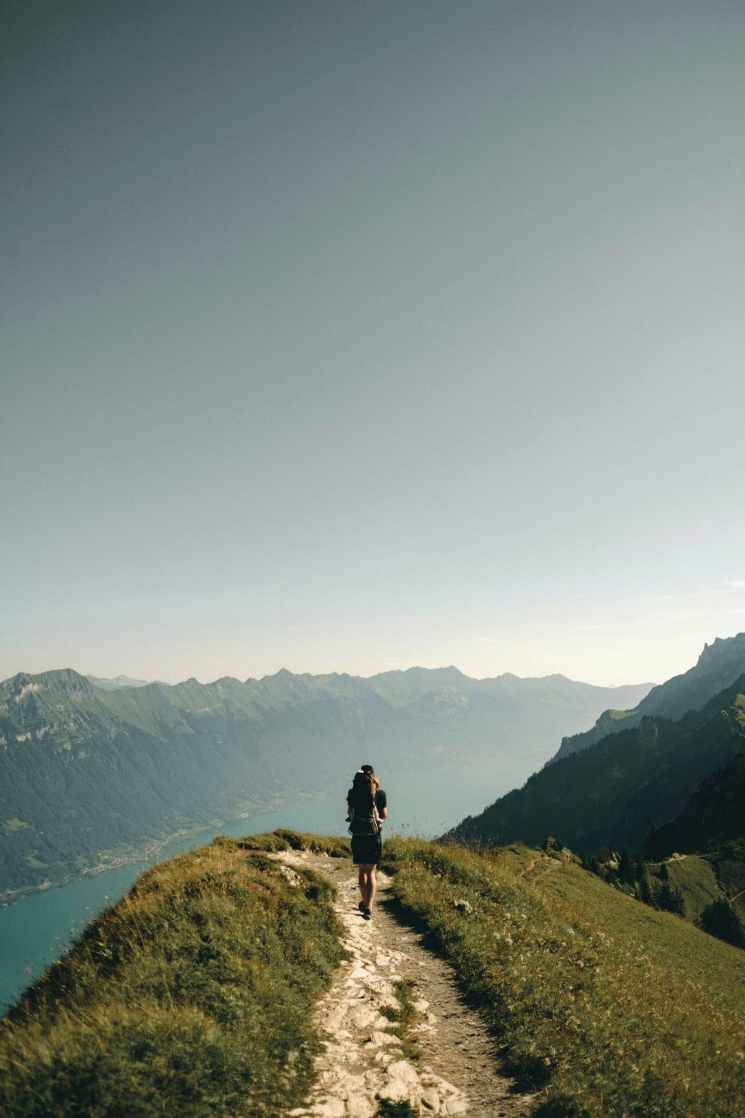 Hiker with pack on alpine ridge trail — Deuter NZ hiking packs at Dwights