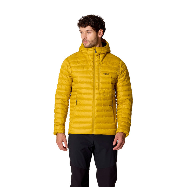 Man wearing the Rab Microlight Alpine Down Hoody in Dark Pollen, front view with hood up.