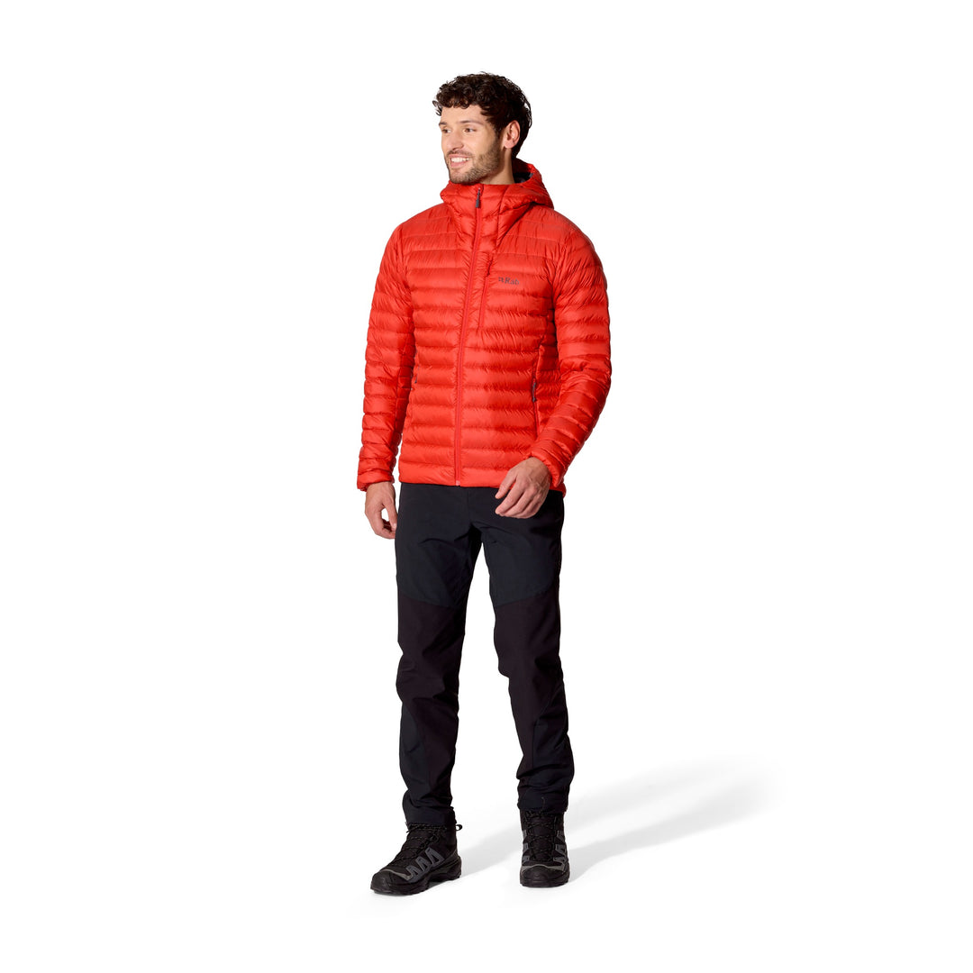 Full-length front view of a man wearing the Rab Microlight Alpine Down Hoody in Dark Horizon.