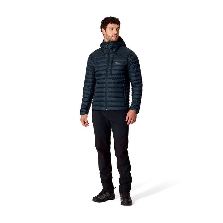 Full-length front view of a man wearing the Rab Microlight Alpine Down Hoody in Galaxy Blue.