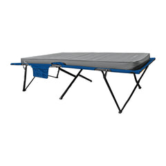 Low side view of the CloudMat and Quick Set King Single combo, showing the mattress thickness, folding steel legs, brackets and cross-bracing.