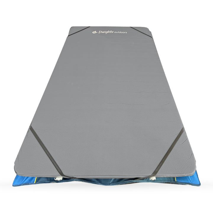 Elevated view of the CloudMat Twin sleeping surface on the Quick Set Queen Stretcher, with Dwights branding, corner straps and two short-end valves.