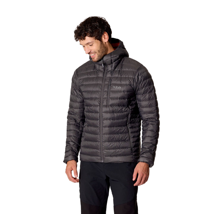 Man wearing the Men’s Rab Microlight Alpine Down Hoody in Graphene, three-quarter front fit view.