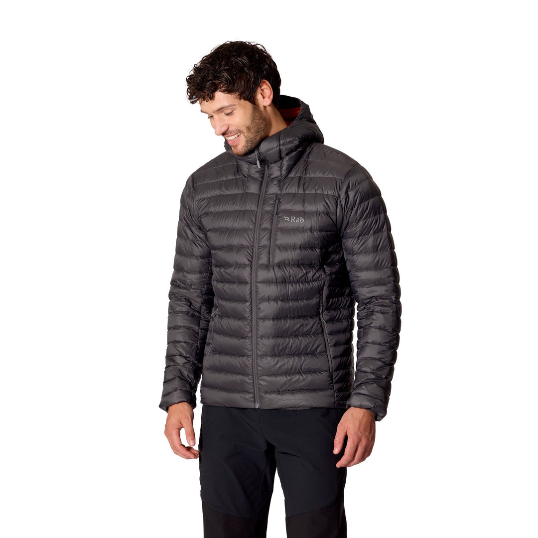 Man wearing the Men’s Rab Microlight Alpine Down Hoody in Graphene, three-quarter front fit view.