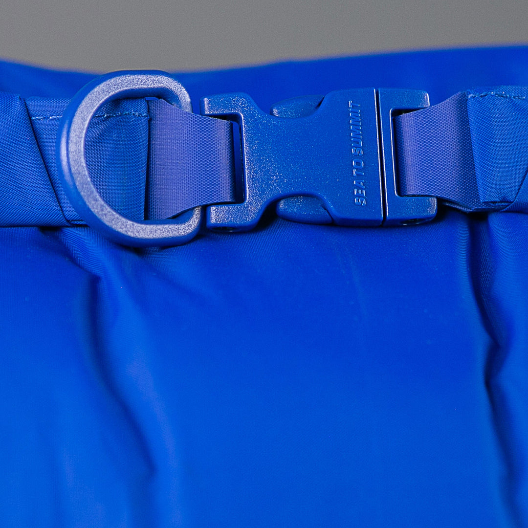 Close-up of the Sea to Summit Lightweight Dry Bag roll-top closure, Field Repair Buckle and D-ring; range detail.