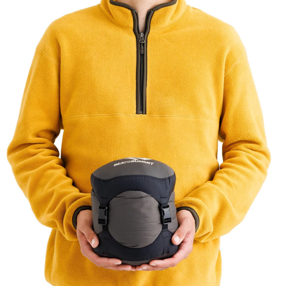Sea to Summit Spark Down Sleeping Bag −1°C – packed size shown in hand