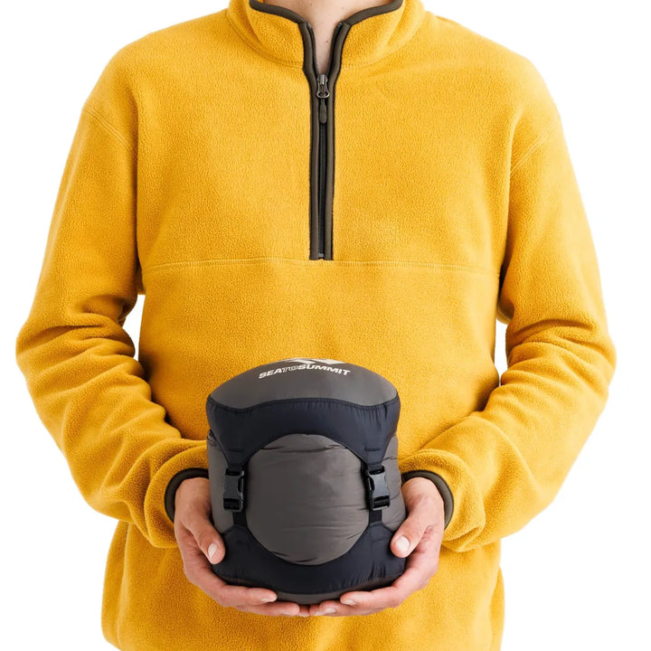 Sea to Summit Spark Down Sleeping Bag −1°C – packed size shown in hand