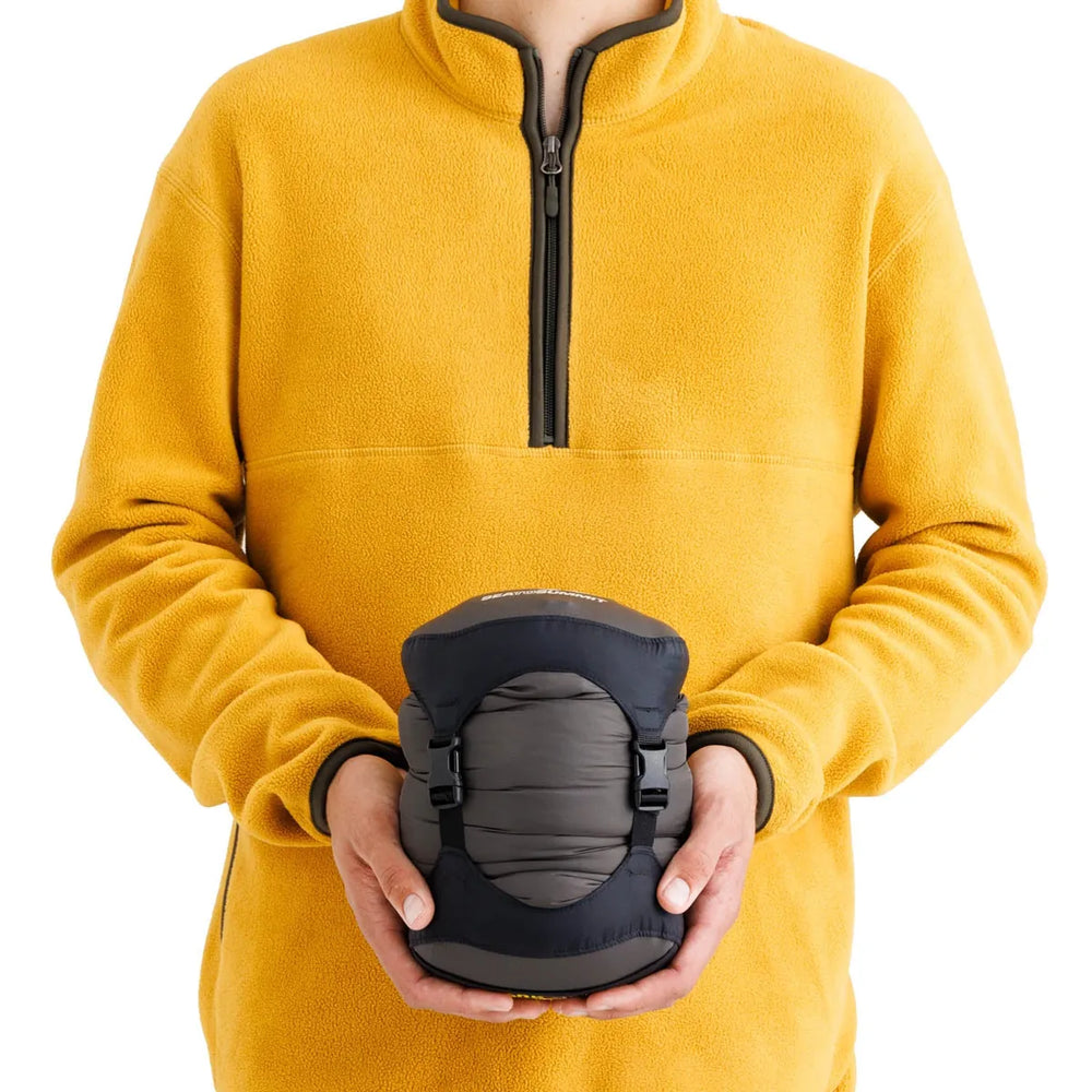 Sea to Summit Spark Women's Down Sleeping Bag −1°C – packed size shown in hand