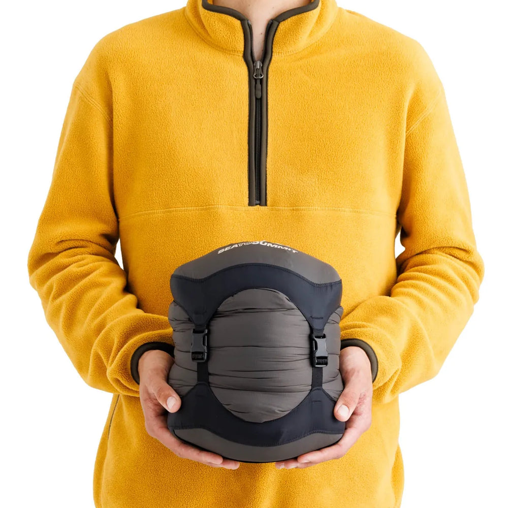 Sea to Summit Spark Women's Down Sleeping Bag −9°C – packed size shown in hand